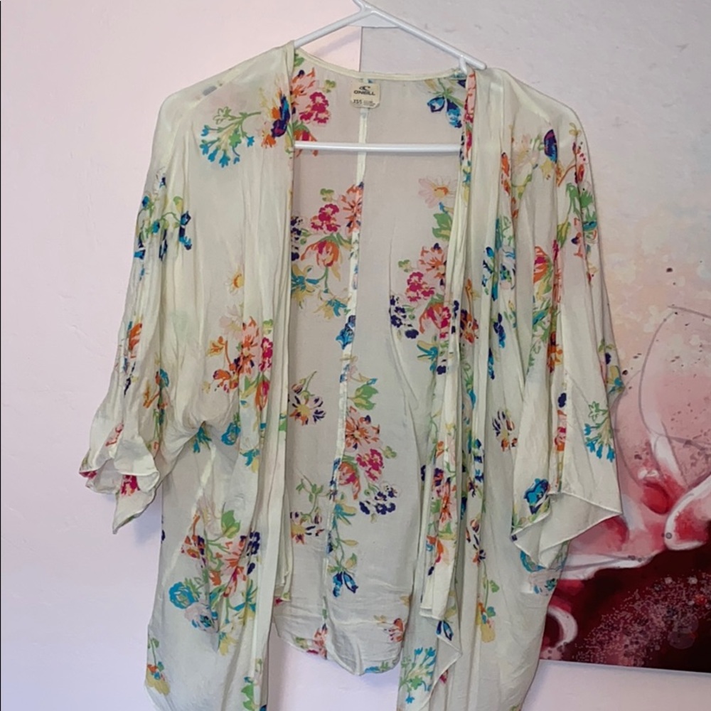 Off-white O’Neill floral Coachella coverup.